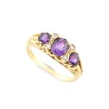 An 18ct yellow gold amethyst & diamond ring, the three oval & round cut amethysts alternating with