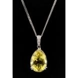 Property of a lady - a 14ct white gold cut pear shaped lemon quartz pendant with diamond set