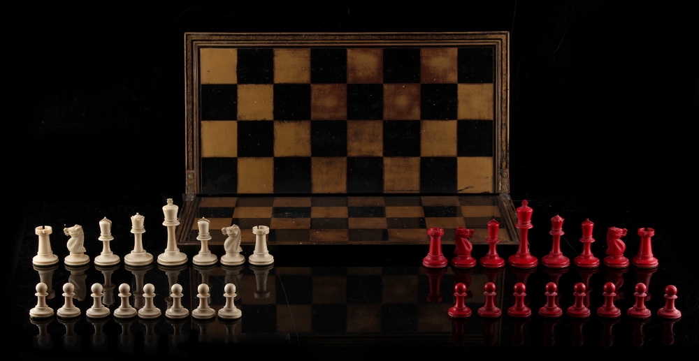 Property of a lady - a 19th century Staunton pattern carved red stained & natural ivory chess set,