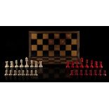 Property of a lady - a 19th century Staunton pattern carved red stained & natural ivory chess set,