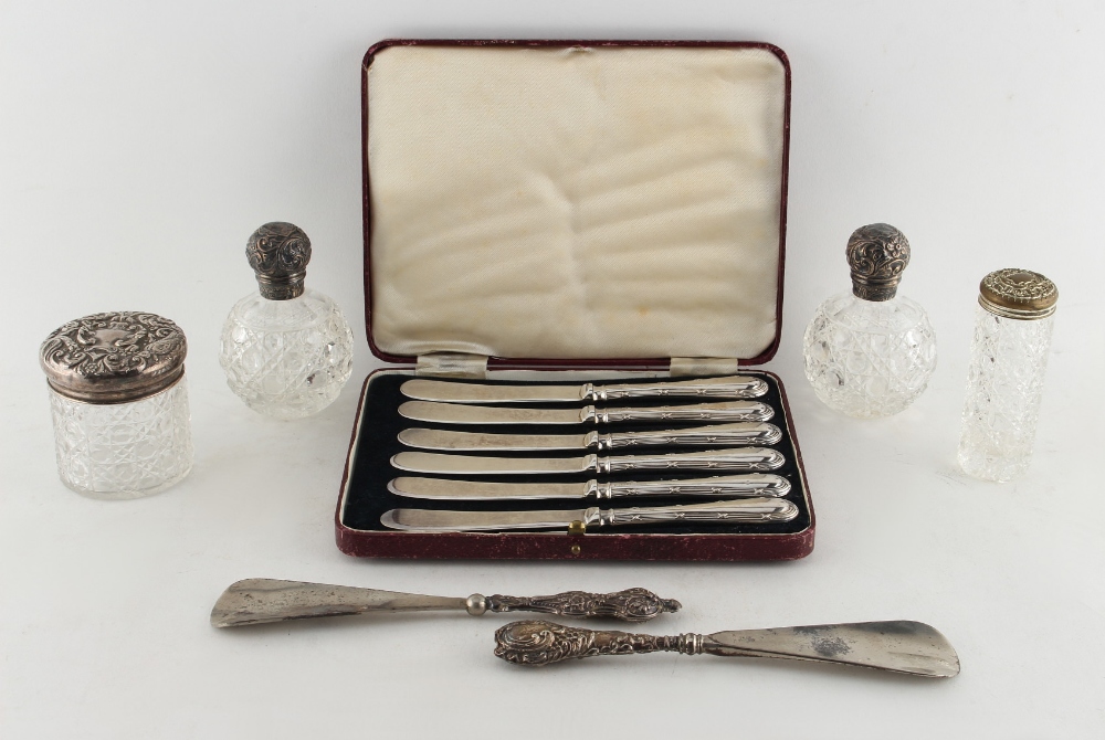 Property of a deceased estate - a cased set of six silver handled tea knives; together with a pair