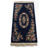 Property of a gentleman - a modern Chinese woollen hand-knotted rug, with blue ground, 72 by