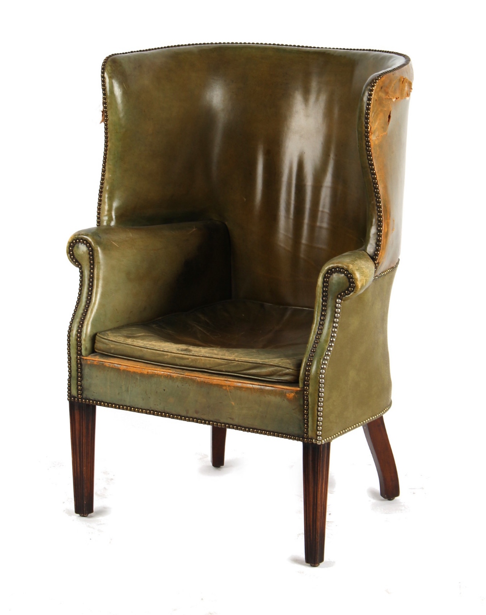 Property of a gentleman - a George III style green leather upholstered wing armchair, damages to