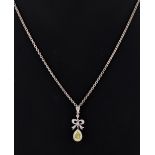 A certificated fancy intense yellow diamond pendant, on 18ct white gold chain necklace, the pear