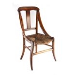A 19th century child's fruitwood chair with rush seat.
