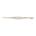 An early 20th century Art Deco unmarked yellow gold & platinum diamond bar brooch, the estimated