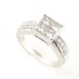 Property of a gentleman - a modern 18ct white gold diamond ring, the square setting with four