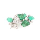 An unmarked white gold emerald & diamond floral spray brooch, with four carved & polished emerald