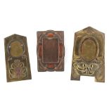 Property of a lady - three Arts & Crafts copper & brass photograph frames, the largest 11.6ins. (