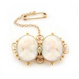 Property of a lady - a late 19th / early 20th century 15ct yellow gold twin cameo brooch, with