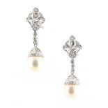An impressive pair of 18ct white gold pearl & diamond pendant earrings, with post & clip fastenings,