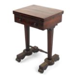 Property of a lady - an early 19th century William IV rosewood swivel-top foldover games table, with