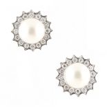 A pair of white gold pearl & diamond cluster earrings, with post & butterfly fastenings, each with a
