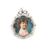 An early 20th century Belle Epoque diamond & pearl circular framed portrait miniature depicting a