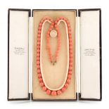 A coral single strand necklace, the seventy individually knotted graduated beads ranging from
