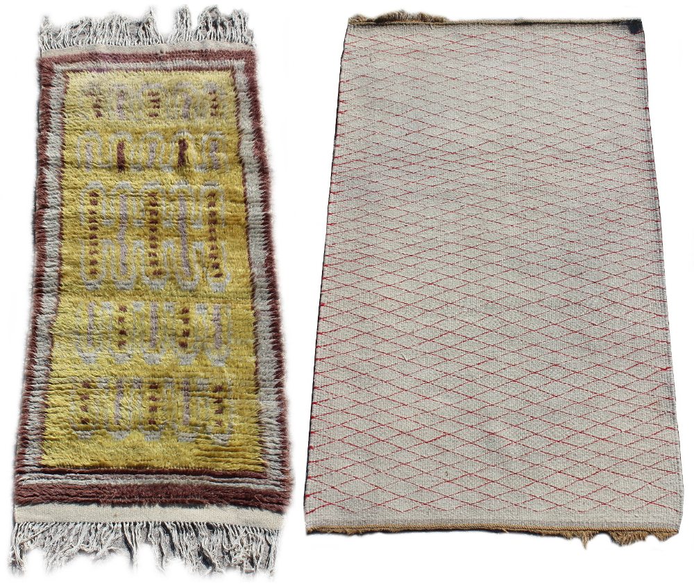 Property of a deceased estate - a hand-knotted wool rug with yellow ground, 62 by 29ins. (158 by