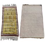 Property of a deceased estate - a hand-knotted wool rug with yellow ground, 62 by 29ins. (158 by