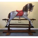 Property of a lady - an early 20th century dappled grey painted wooden rocking horse.