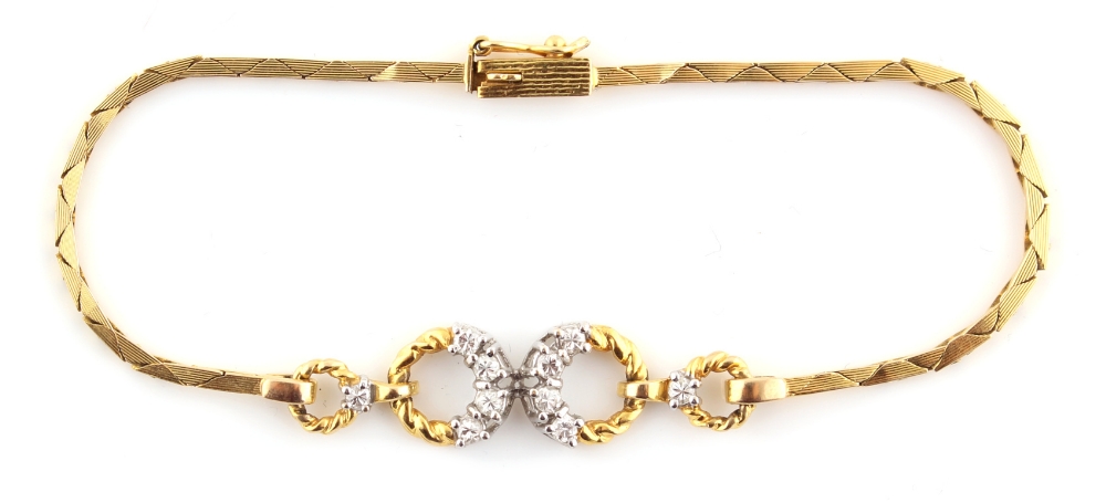 Property of a lady - an 18ct yellow gold & diamond set link bracelet, the total diamond weight