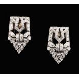 A pair of Art Deco style diamond clips, the round brilliant & single cut diamonds weighing a total