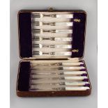 Property of a lady - a cased set of six each silver dessert knives & forks with mother-of-pearl