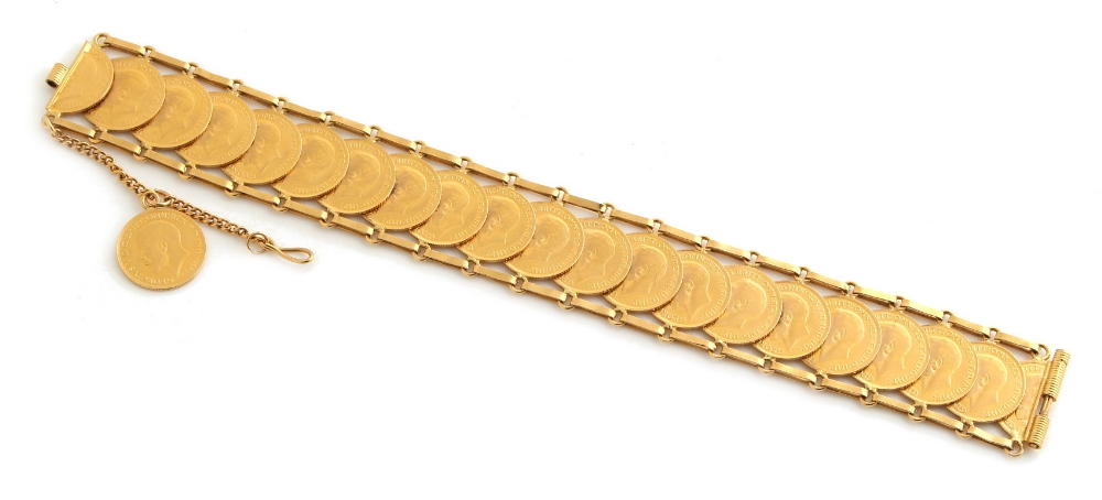 Property of a lady - gold coins - an unmarked gold (tests 18ct) bracelet set with 21 gold half