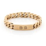 Property of a lady - a heavy 9ct gold identity bracelet, approximately 69.4 grams.