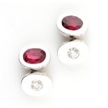 A pair of 18ct white gold ruby & diamond oval panelled cufflinks, the two oval cut rubies each