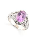 A good certificated unheated Ceylon pink sapphire & diamond ring, with unusual interlocking loop