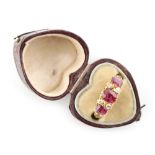 Property of a lady - an early 20th century 18ct yellow gold ruby & diamond ring, with three oval