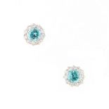 A pair of zircon & diamond cluster earrings, with post & butterfly fastenings, each with a round cut