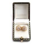 Property of a lady - a pair of 18ct yellow gold diamond flowerhead cluster earrings, the Old