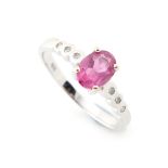 Property of a lady - an 18ct white gold pink tourmaline ring, the oval cut pink tourmaline in claw