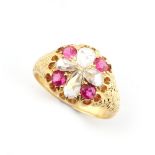 A Victorian 18ct yellow gold ruby & diamond flowerhead ring, set with four round cut rubies