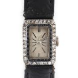 An early 20th century Belle Epoque lady's platinum tank cased wristwatch with sapphire & diamond