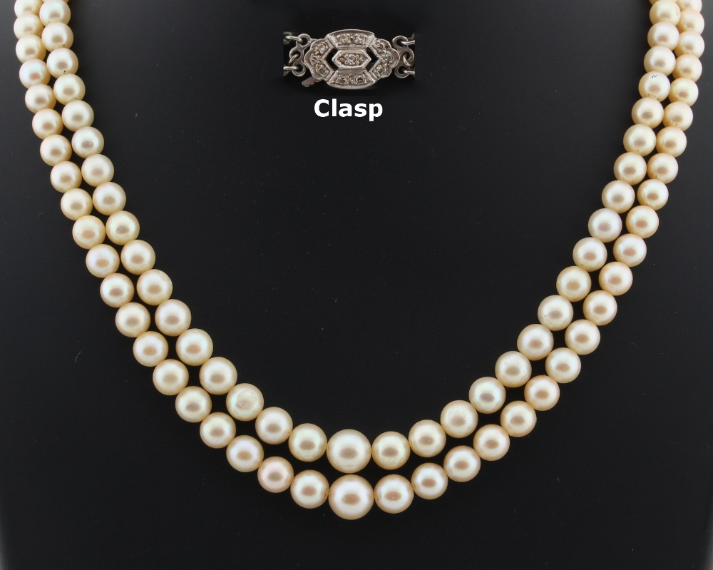 Property of a deceased estate - a cultured pearl two strand necklace, the largest of the 136