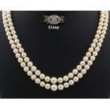 Property of a deceased estate - a cultured pearl two strand necklace, the largest of the 136