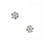 A pair of white gold diamond flowerhead cluster earrings, with post & butterfly fastenings, each