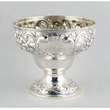Property of a lady - a Queen Anne Scottish silver pedestal bowl, with repousse decoration