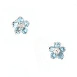 A pair of zircon & diamond flowerhead earrings, with post & butterfly fastenings, each with five