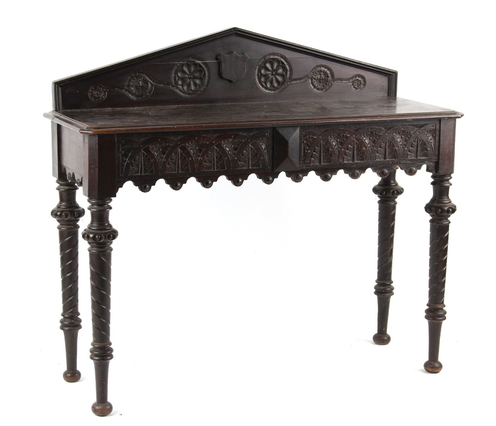 Property of a deceased estate - a late 19th / early 20th century carved oak hall table, with two end