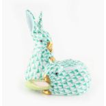 Property of a gentleman - a Herend fishnet model of two rabbits, 3.4ins. (8.6cms.) high.