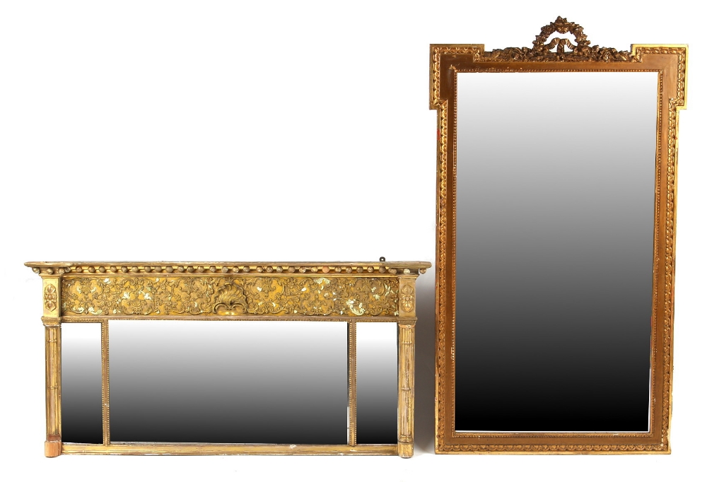 Property of a lady - a late 19th / early 20th century gilt painted wall mirror with eared top and