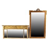 Property of a lady - a late 19th / early 20th century gilt painted wall mirror with eared top and