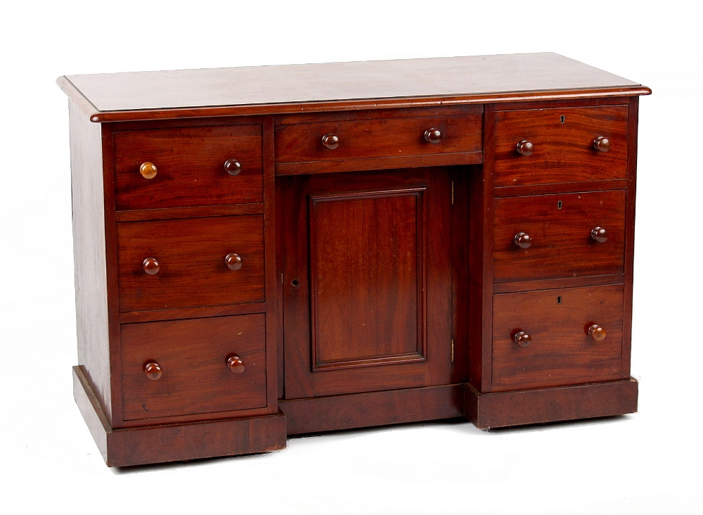 Property of a gentleman - a Victorian mahogany kneehole desk, with turned handles, 47.7ins. (