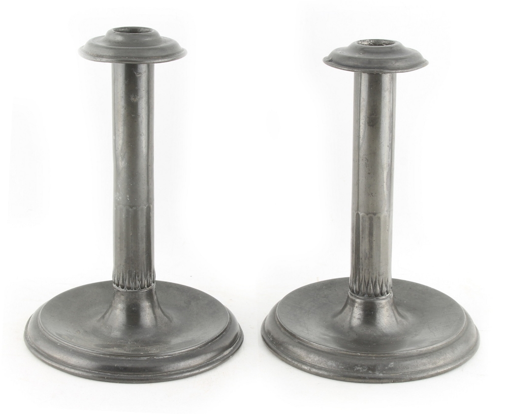 Property of a lady - a pair of Tudric pewter candlesticks, model number 0983, with drip pans, 7.