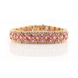 An attractive 14ct yellow gold ruby & diamond bracelet, the eighty-eight baguette cut rubies