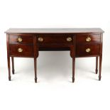 Property of a lady - an early 19th century mahogany bow-fronted sideboard, with six square