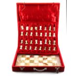 Property of a gentleman - an onyx chess set & board, in original red velveteen covered box, the