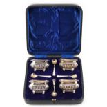 Property of a lady - a set of four Edwardian silver salts, with matching spoons, James Deakin &
